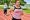 overweight woman running on track