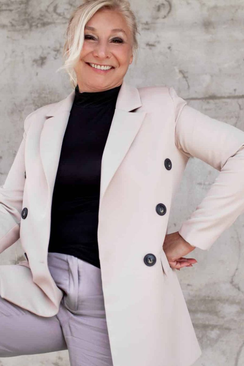 Happy professional woman in suit coat